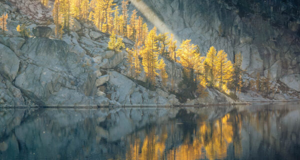 Sunlight streams on lake in the Enchantments area of the Alpine Lakes Wilderness, Washington