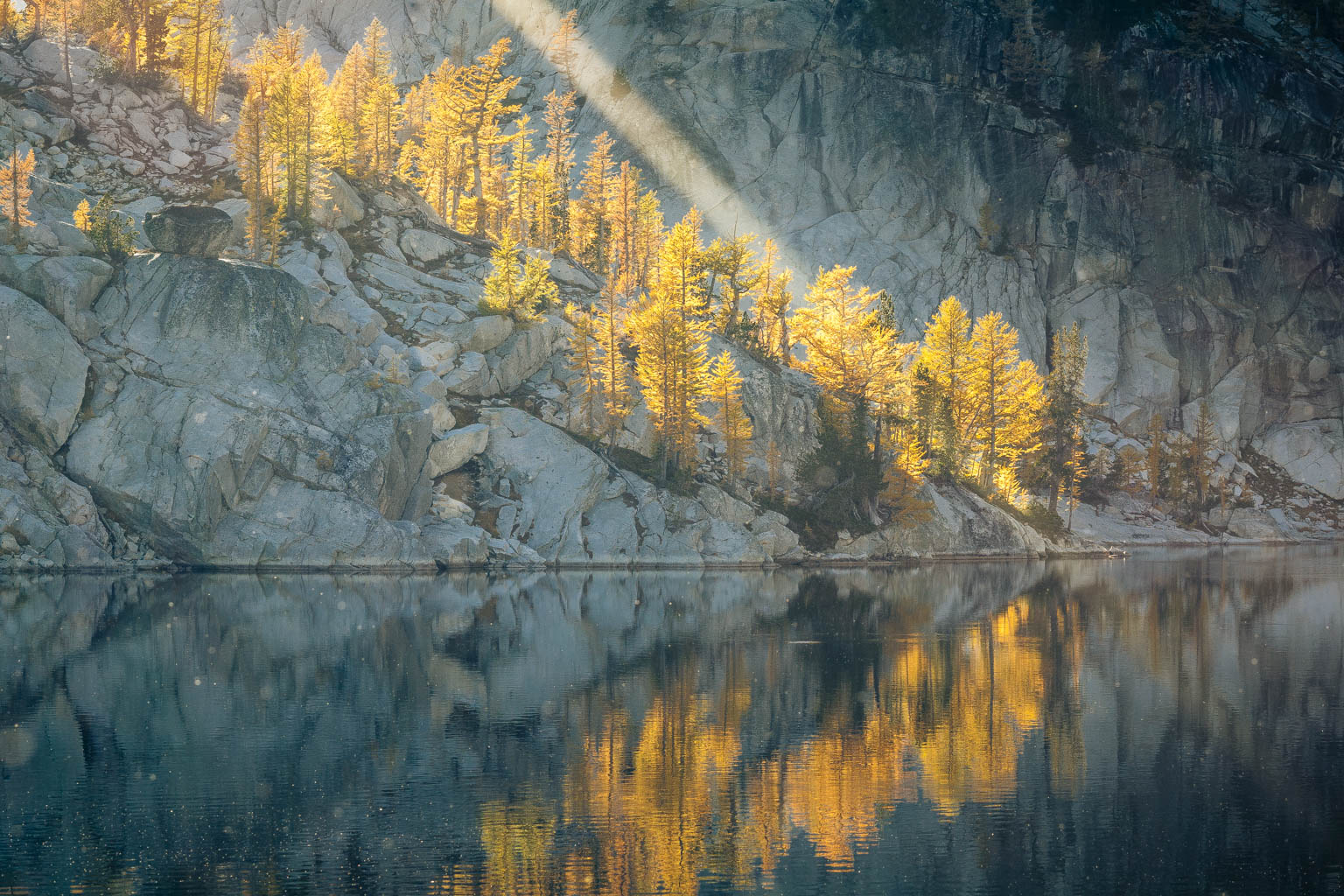 Sunlight streams on lake in the Enchantments area of the Alpine Lakes Wilderness, Washington
